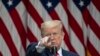 U.S. -- In this May 11, 2020 photo, President Donald Trump points to a question as he speaks about the coronavirus during a press briefing in the Rose Garden of the White House in Washington.